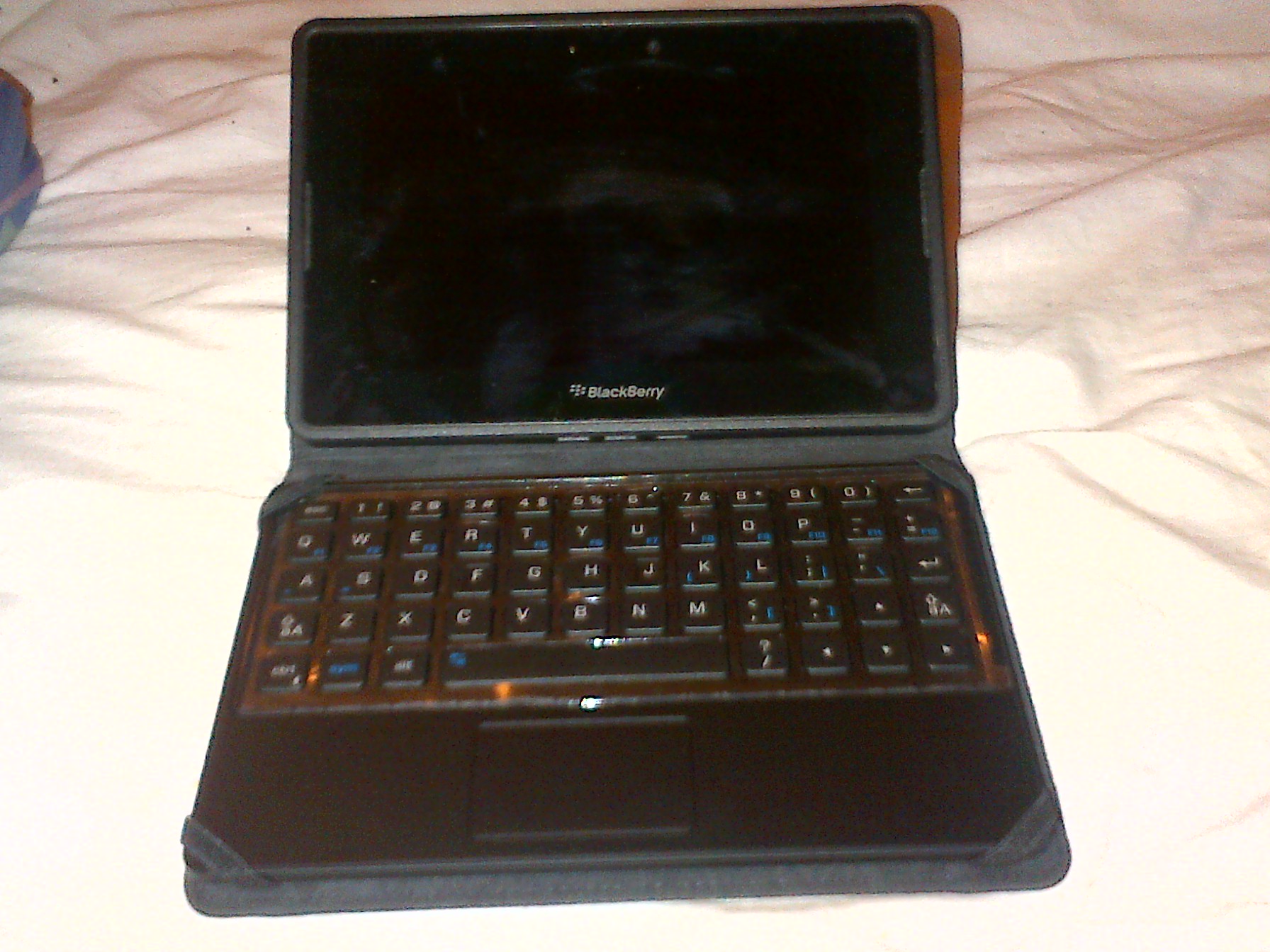 BlackBerry PlayBook, small rectangular tablet in a case with a full keyboard