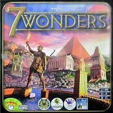 A square box with images of the 7 wonders of the ancient world on it. Text reads 7 Wonders