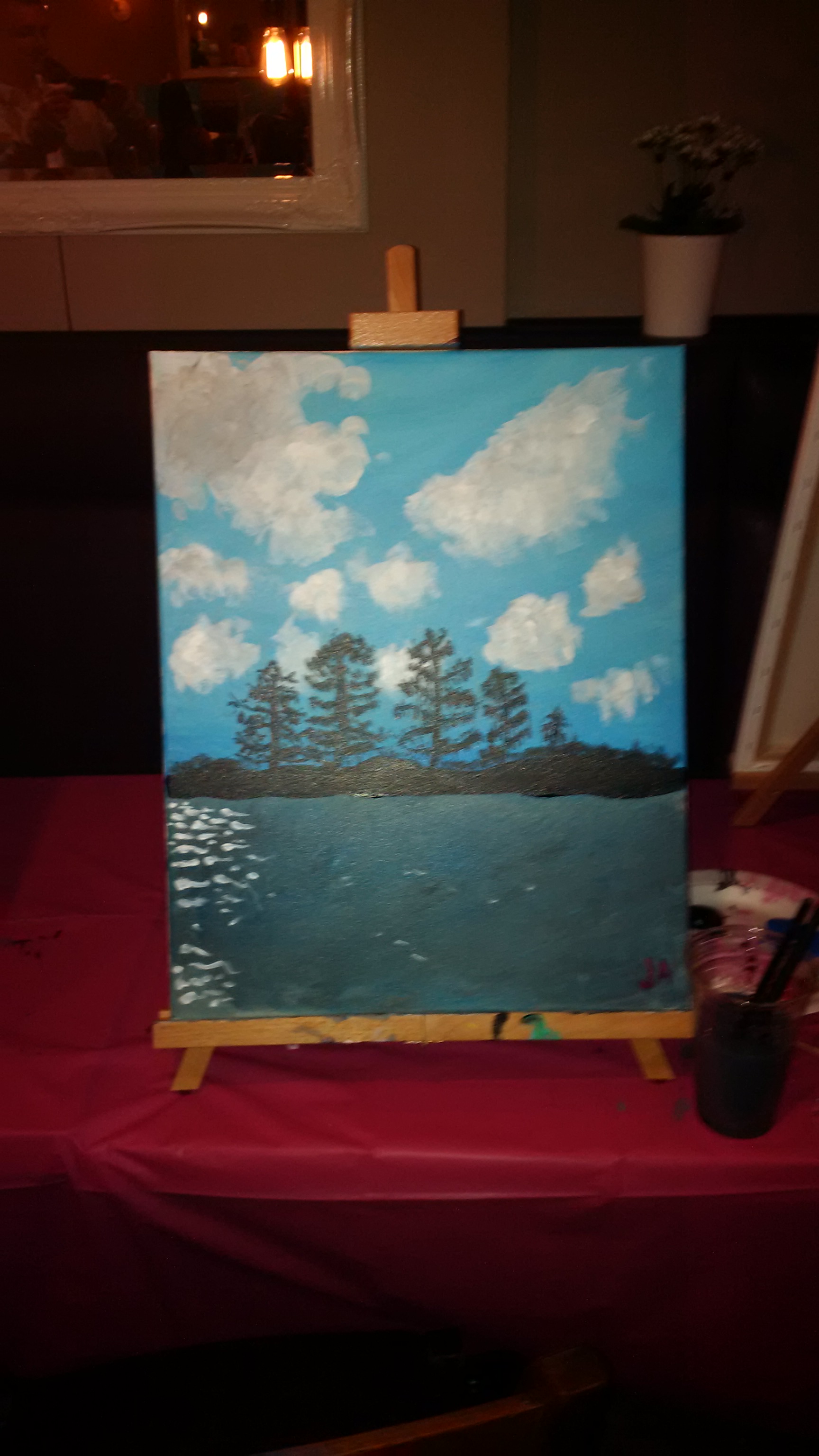 A painting of four pine trees on an island with clouds in the background.