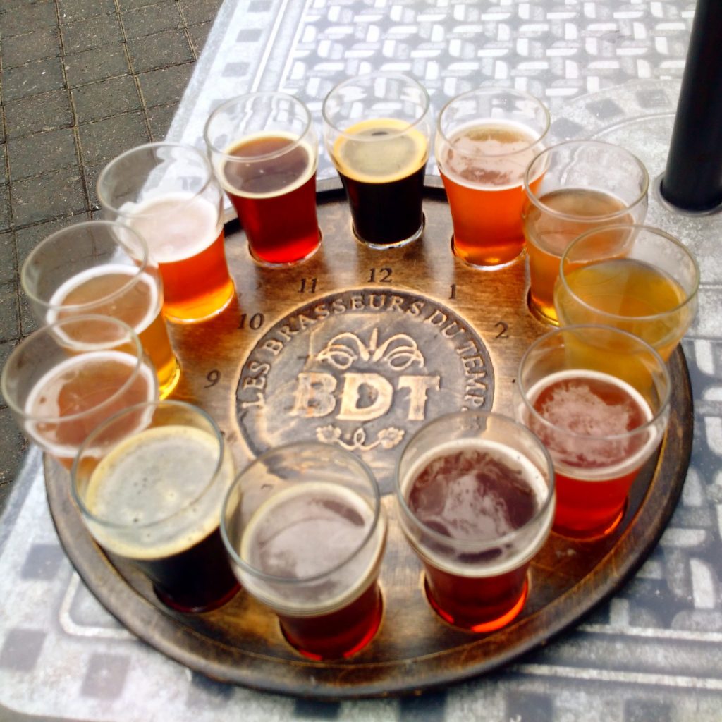 Beer sampler glasses on a round platter