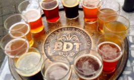 Beer sampler glasses on a round platter